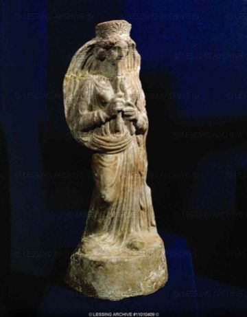 GREEK,ROMAN,ETRUSCAN TERRACOTTAS Female musician playing the double flute. Terracotta (4th BCE), from the Punic necropolis of Borj Jdid, Carthago. Phoenician culture Louvre Museum